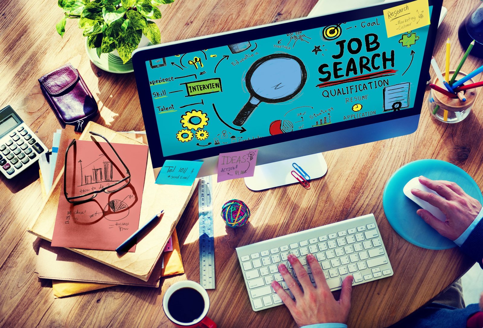 a person typing on a computer searching for a job on Aussie Jobs